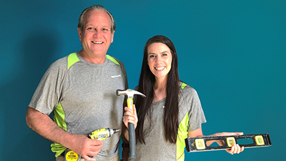 photo of ron perine and christine millette holding tools