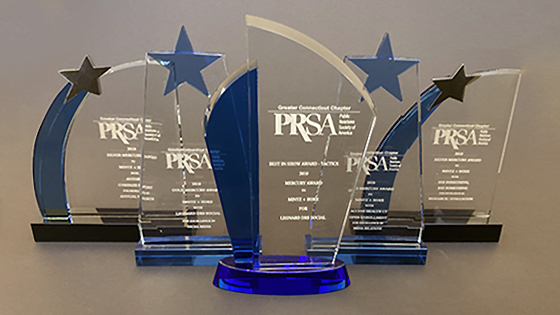 a group photo of five prsa awards