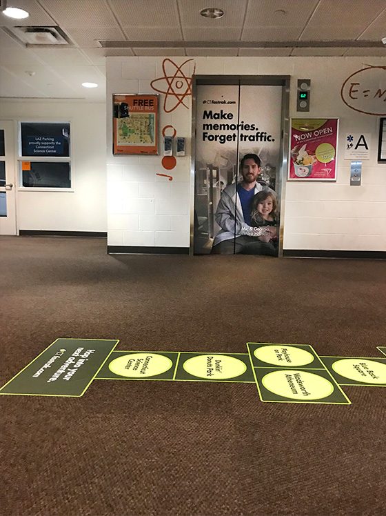 CTfastrak elevator wrap and hopscotch placement at CT science center