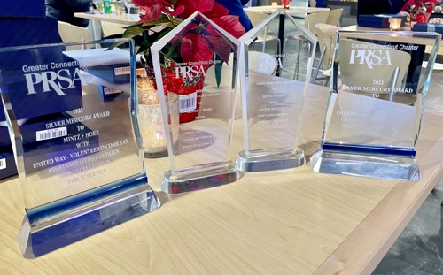 Four PRSA awards sitting on a table